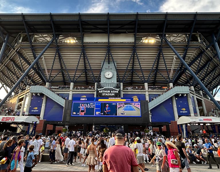 A crowd of tennis fans going into Arthur Ashe Stadium for the US Open.